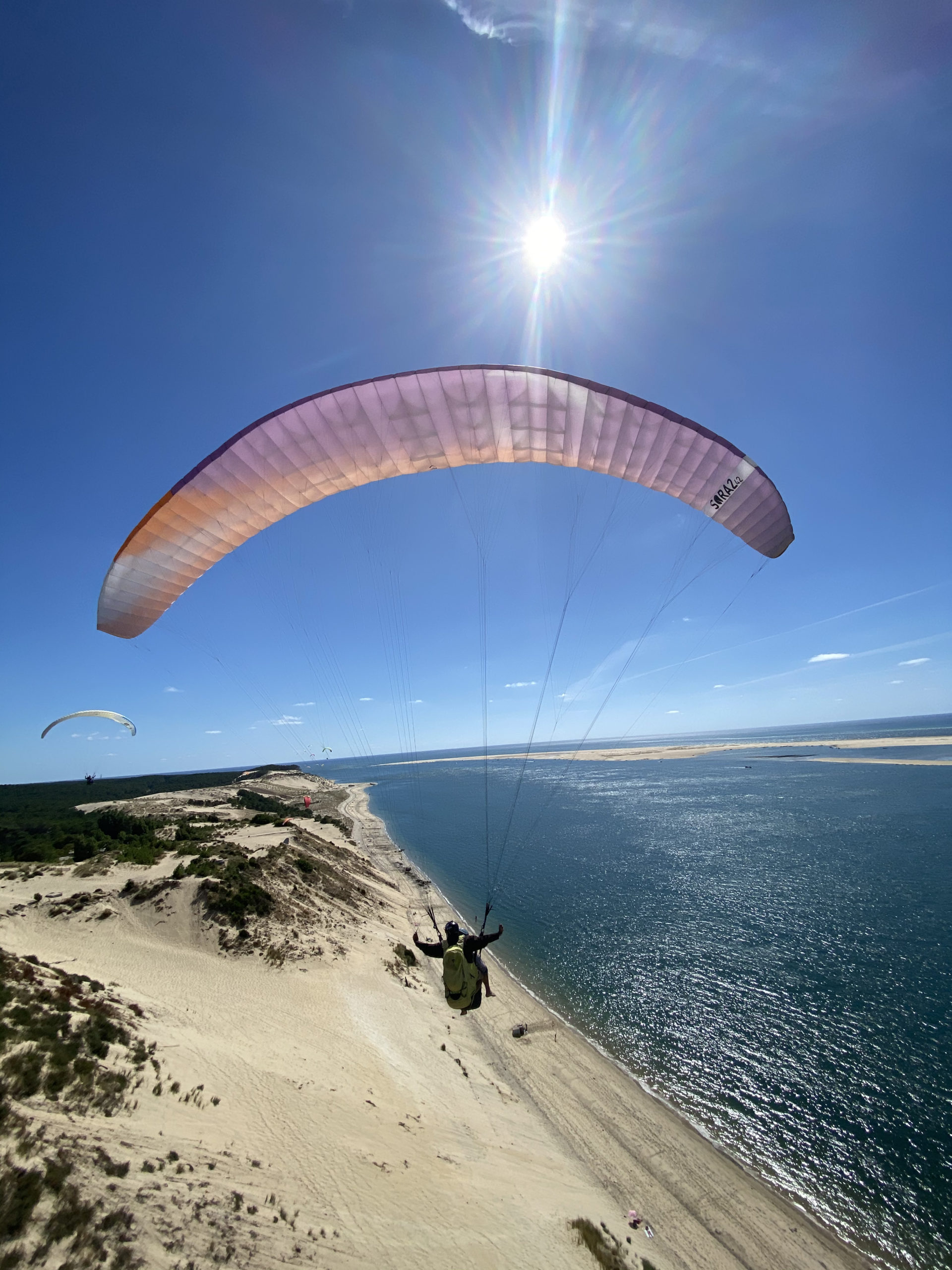 Baptême de l'air en parapente biplace pédagogique au-dessus de la dune du Pilat.